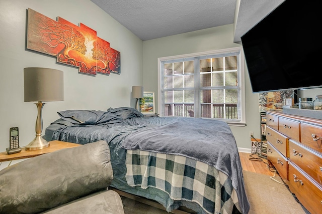1013 Laurel Hills Dr, Dickson, TN 37055 - bedroom with light wood-style floors and a textured ceiling