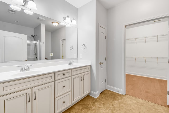 835 Meadowcrest Way, Lebanon, TN 37090 - bathroom featuring a stall shower, double vanity, and a spacious closet