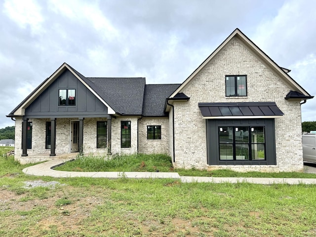 165 Crenshaw Rd, Hartsville, TN 37074 - modern farmhouse with brick siding and board and batten siding