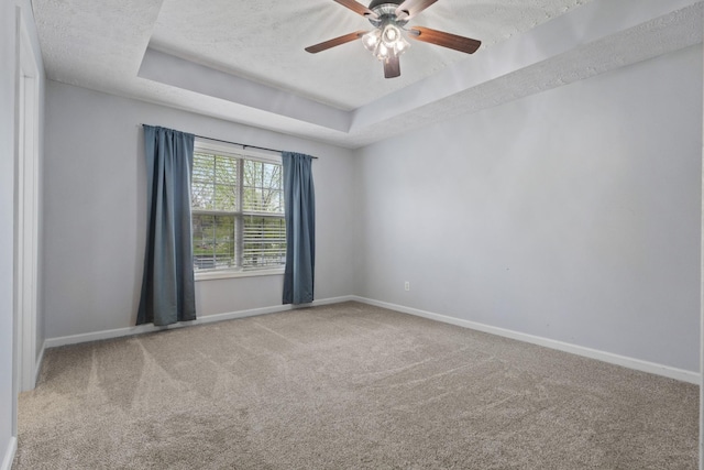 989 Ernest Stewart Dr, Clarksville, TN 37042 - carpeted empty room with a tray ceiling, a ceiling fan, and a textured ceiling