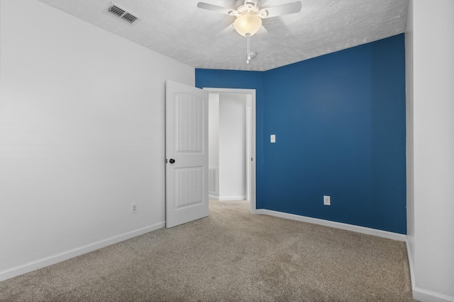 989 Ernest Stewart Dr, Clarksville, TN 37042 - spare room with carpet floors, a textured ceiling, and a ceiling fan