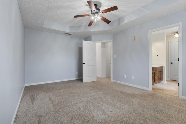 989 Ernest Stewart Dr, Clarksville, TN 37042 - unfurnished bedroom featuring light carpet, a raised ceiling, a textured ceiling, and ceiling fan