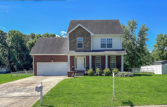 989 Ernest Stewart Dr, Clarksville, TN 37042 - traditional-style house with driveway, a garage, brick siding, a porch, and roof with shingles