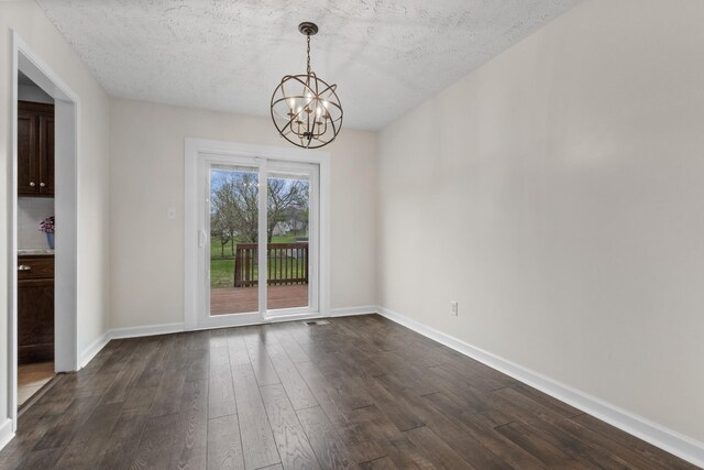 989 Ernest Stewart Dr, Clarksville, TN 37042 - unfurnished dining area featuring a chandelier, dark wood-style floors, and a textured ceiling
