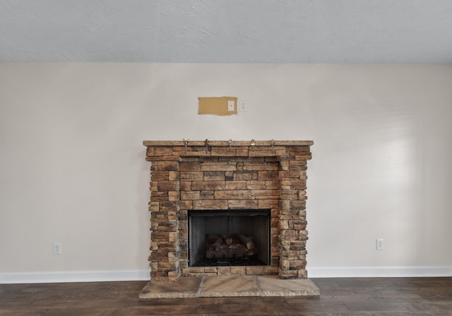 989 Ernest Stewart Dr, Clarksville, TN 37042 - detailed view of wood finished floors, a fireplace, and a textured ceiling