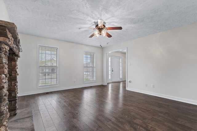 989 Ernest Stewart Dr, Clarksville, TN 37042 - unfurnished living room with a ceiling fan, dark wood finished floors, and a textured ceiling