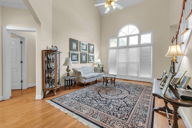 8013 Rosemere Way, Chattanooga, TN 37421 - living area featuring a ceiling fan, a towering ceiling, and light wood-type flooring