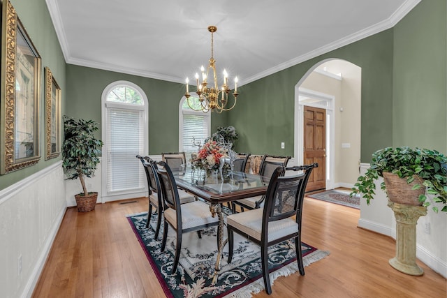 8013 Rosemere Way, Chattanooga, TN 37421 - dining space featuring arched walkways, light wood-type flooring, a chandelier, and ornamental molding