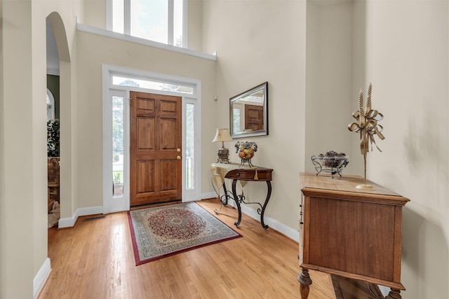 8013 Rosemere Way, Chattanooga, TN 37421 - entryway with arched walkways, light wood-style flooring, and a towering ceiling