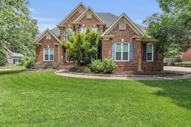8013 Rosemere Way, Chattanooga, TN 37421 - view of front of house with brick siding, a front lawn, and a shingled roof