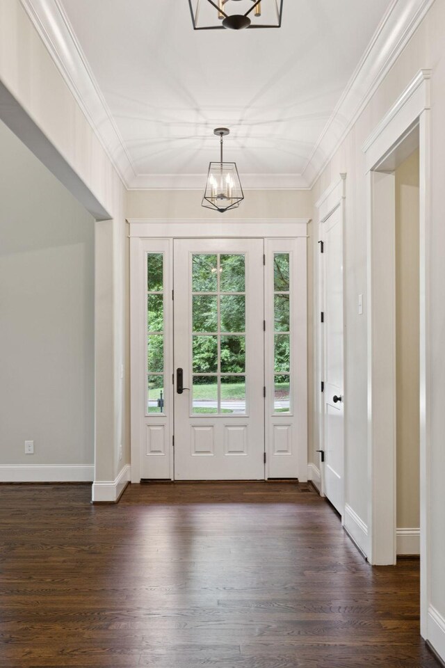 703 Welsh Ln, Franklin, TN 37064 - entryway with a chandelier, dark wood finished floors, and ornamental molding
