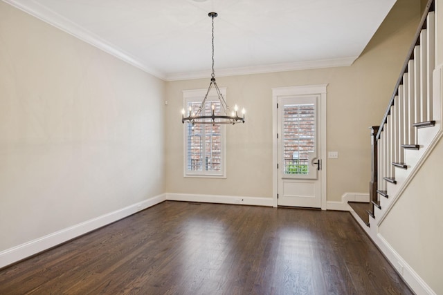 703 Welsh Ln, Franklin, TN 37064 - foyer with a chandelier, stairway, dark wood-style flooring, and crown molding