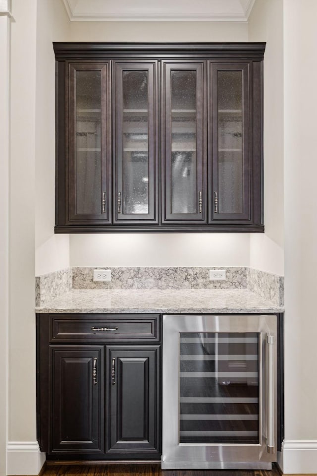 703 Welsh Ln, Franklin, TN 37064 - indoor dry bar with wine cooler and crown molding