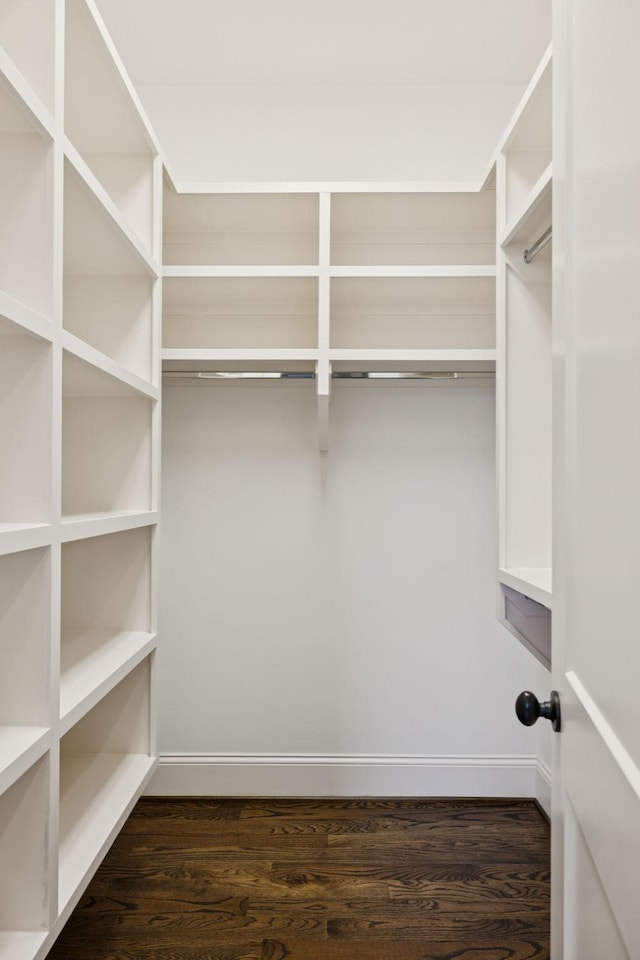 703 Welsh Ln, Franklin, TN 37064 - walk in closet with dark wood finished floors
