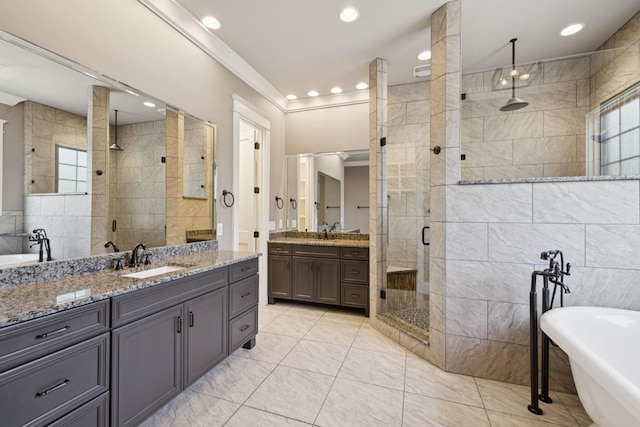 703 Welsh Ln, Franklin, TN 37064 - bathroom with a shower stall, a freestanding tub, two vanities, crown molding, and recessed lighting