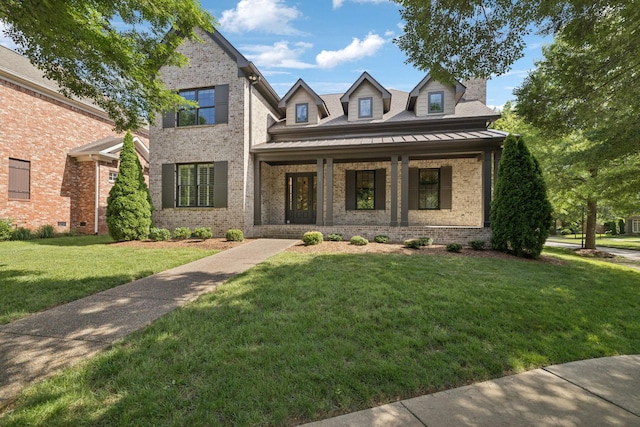703 Welsh Ln, Franklin, TN 37064 - view of front of property featuring brick siding, a front lawn, covered porch, and a standing seam roof