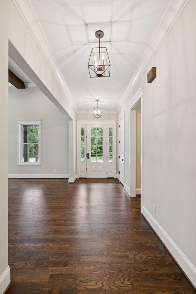 703 Welsh Ln, Franklin, TN 37064 - foyer entrance featuring a chandelier, plenty of natural light, dark wood finished floors, and ornamental molding