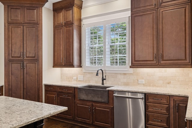 703 Welsh Ln, Franklin, TN 37064 - kitchen with stainless steel dishwasher, backsplash, light stone countertops, and crown molding