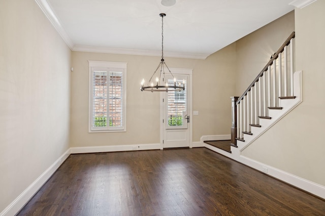 703 Welsh Ln, Franklin, TN 37064 - foyer entrance featuring a chandelier, wood finished floors, crown molding, and stairs