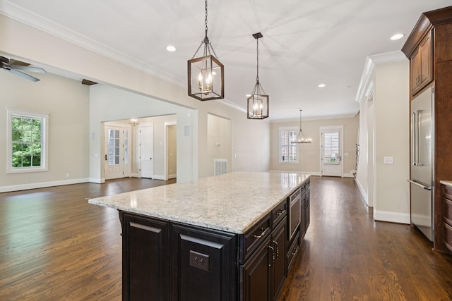 703 Welsh Ln, Franklin, TN 37064 - kitchen with a chandelier, dark wood-type flooring, ornamental molding, recessed lighting, and high end fridge