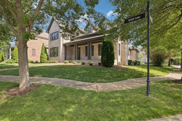 703 Welsh Ln, Franklin, TN 37064 - view of front of house featuring a front lawn and brick siding