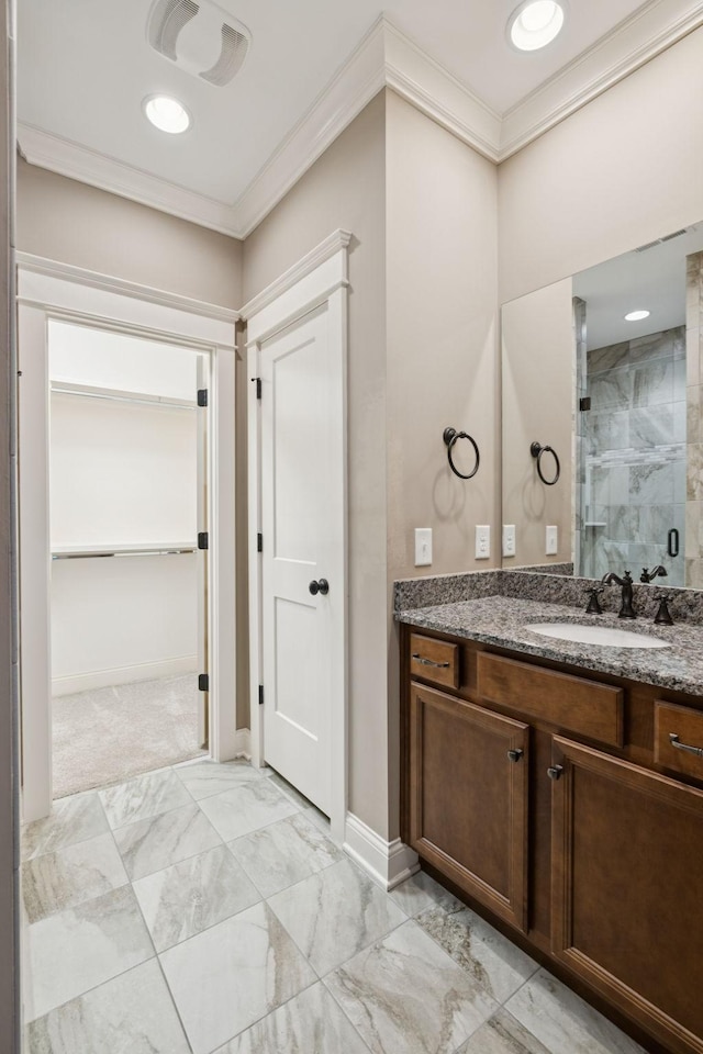 703 Welsh Ln, Franklin, TN 37064 - bathroom with ornamental molding, vanity, marble finish flooring, a shower stall, and a walk in closet