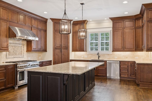 703 Welsh Ln, Franklin, TN 37064 - kitchen with stainless steel appliances, wall chimney exhaust hood, a center island, dark wood-style floors, and decorative backsplash