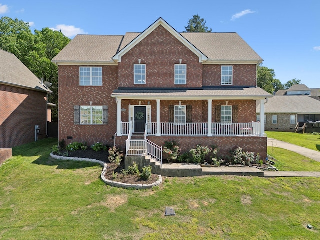 1012 Tulip Blossom Dr, Hermitage, TN 37076 - view of front facade with covered porch, a front yard, and brick siding