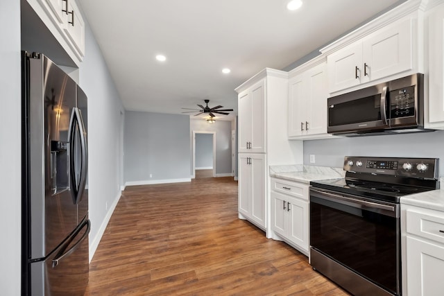 222 Groh St, Lawrenceburg, TN 38464 - kitchen with appliances with stainless steel finishes, a ceiling fan, white cabinetry, wood finished floors, and recessed lighting