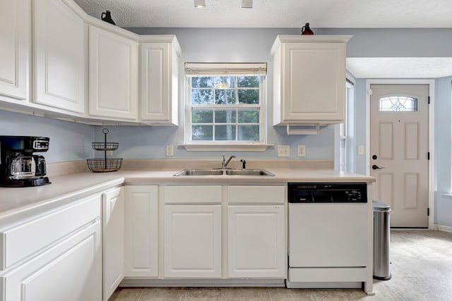 109 New Haven Ct, Nashville, TN 37214 - kitchen featuring dishwasher, healthy amount of natural light, white cabinetry, and a textured ceiling