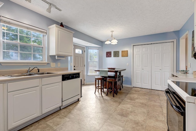 109 New Haven Ct, Nashville, TN 37214 - kitchen with white dishwasher, electric stove, a textured ceiling, white cabinetry, and healthy amount of natural light