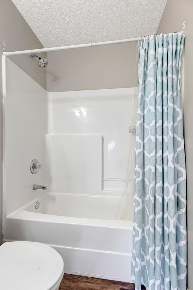 109 New Haven Ct, Nashville, TN 37214 - bathroom with a textured ceiling, shower / tub combo with curtain, and wood finished floors