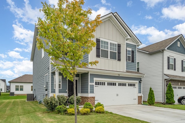 3716 Capstone Dr, Murfreesboro, TN 37128 - view of front of home with board and batten siding, a garage, a front yard, and driveway