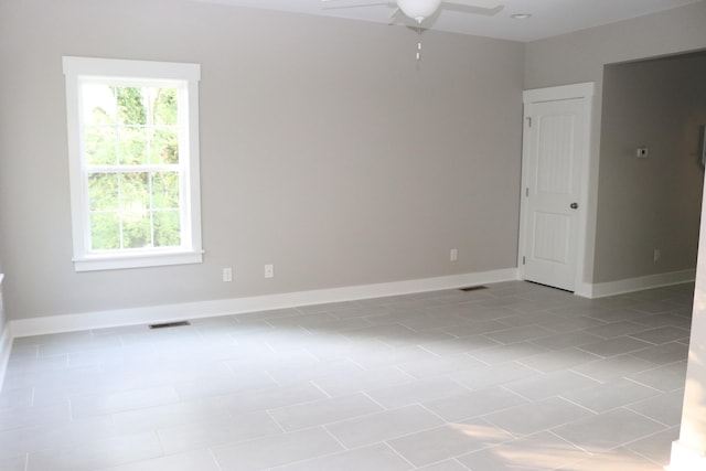 721 Poplar St, Columbia, TN 38401 - tiled empty room with ceiling fan and baseboards