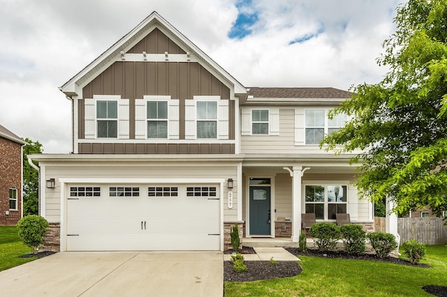 269 Grassy Glen Dr, Gallatin, TN 37066 - craftsman-style home with board and batten siding, a porch, stone siding, and concrete driveway