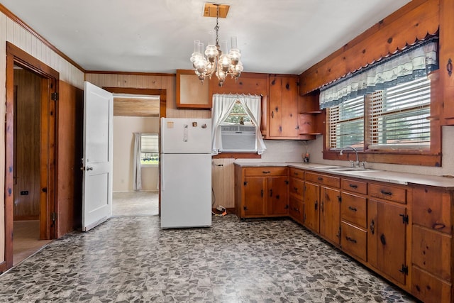75 Lakeside Dr, Rock Island, TN 38581 - kitchen with freestanding refrigerator, a chandelier, brown cabinetry, open shelves, and wood walls