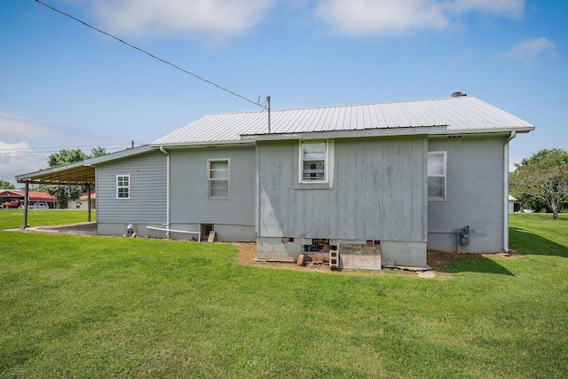 75 Lakeside Dr, Rock Island, TN 38581 - rear view of house with a metal roof and a lawn