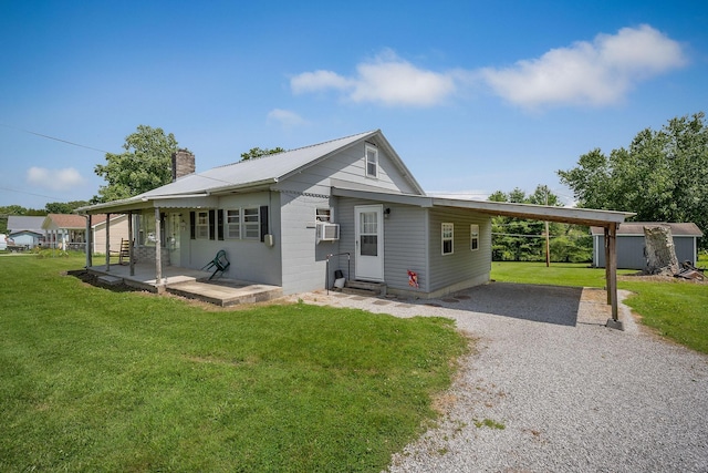 75 Lakeside Dr, Rock Island, TN 38581 - view of front of home with a chimney, a front lawn, an attached carport, driveway, and entry steps