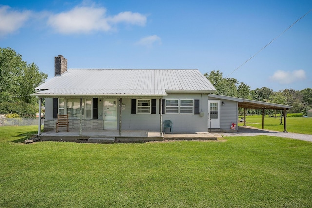75 Lakeside Dr, Rock Island, TN 38581 - view of front of home with covered porch, a chimney, a metal roof, and a front yard