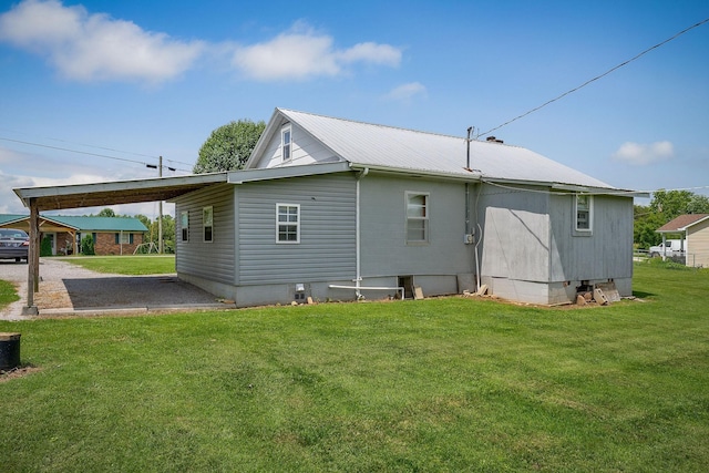 75 Lakeside Dr, Rock Island, TN 38581 - rear view of property with a metal roof, gravel driveway, a yard, and an attached carport