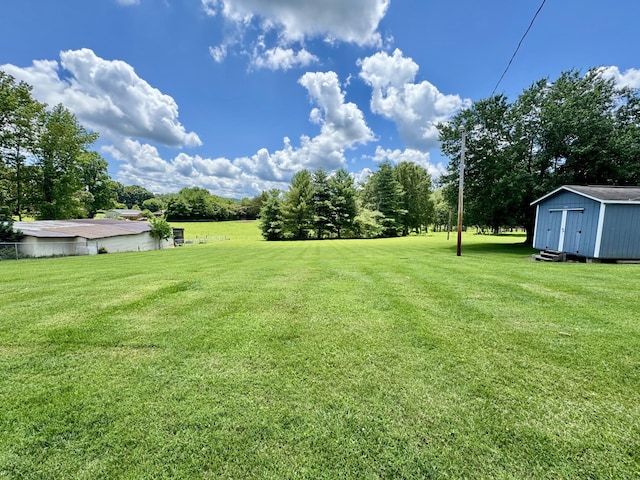 75 Lakeside Dr, Rock Island, TN 38581 - view of green lawn featuring a storage shed