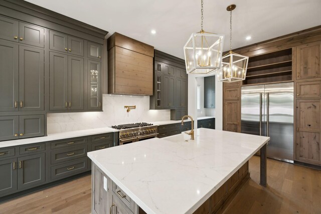 6628 Bethesda Arno Rd, Thompsons Station, TN 37179 - kitchen with high end appliances, wall chimney range hood, open shelves, light wood finished floors, and recessed lighting