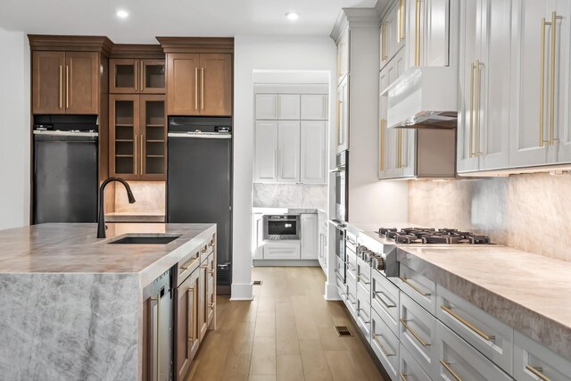 6628 Bethesda Arno Rd, Thompsons Station, TN 37179 - kitchen with stainless steel appliances, light countertops, backsplash, glass insert cabinets, and recessed lighting