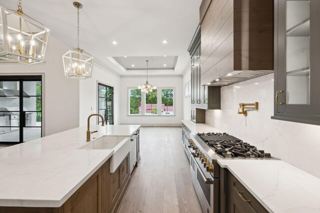 6628 Bethesda Arno Rd, Thompsons Station, TN 37179 - kitchen with a chandelier, double oven range, wall chimney exhaust hood, light wood-style flooring, and recessed lighting