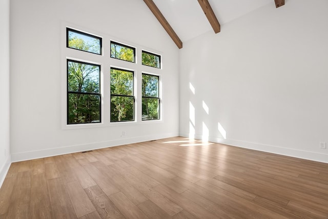 6628 Bethesda Arno Rd, Thompsons Station, TN 37179 - spare room featuring beamed ceiling, wood finished floors, and high vaulted ceiling