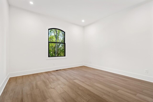 6628 Bethesda Arno Rd, Thompsons Station, TN 37179 - empty room featuring wood finished floors and recessed lighting