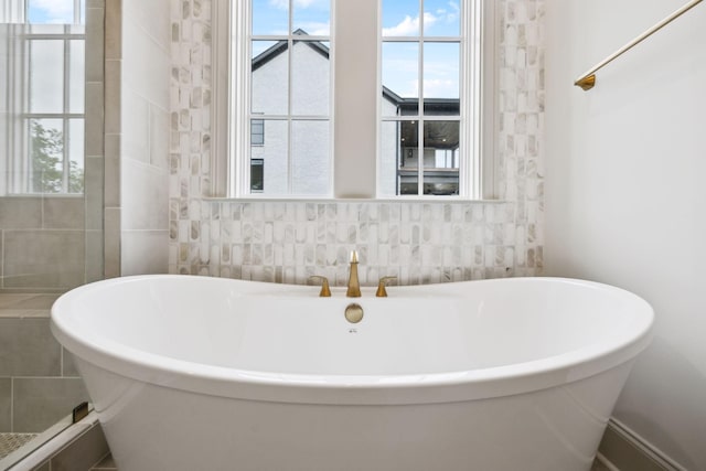 6628 Bethesda Arno Rd, Thompsons Station, TN 37179 - bathroom featuring a freestanding bath and tile walls