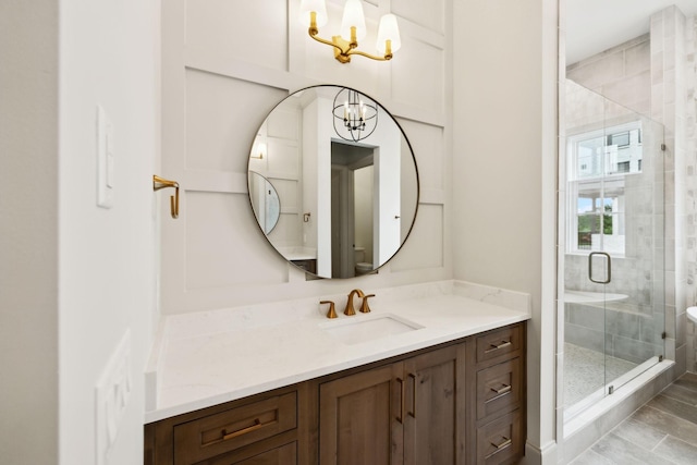 6628 Bethesda Arno Rd, Thompsons Station, TN 37179 - bathroom featuring a chandelier, vanity, and a shower stall