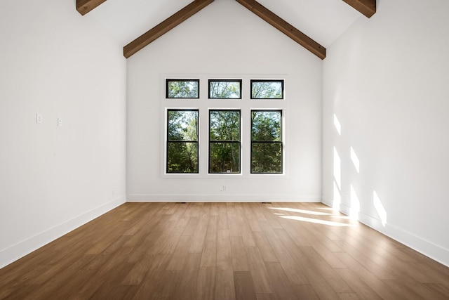 6628 Bethesda Arno Rd, Thompsons Station, TN 37179 - spare room with beam ceiling, wood finished floors, and a towering ceiling