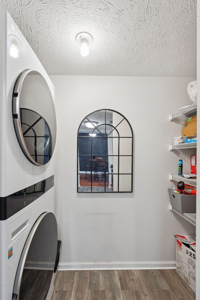 420 Elysian Fields Rd Unit C3, Nashville, TN 37211 - laundry area with stacked washer / dryer, wood finished floors, and a textured ceiling